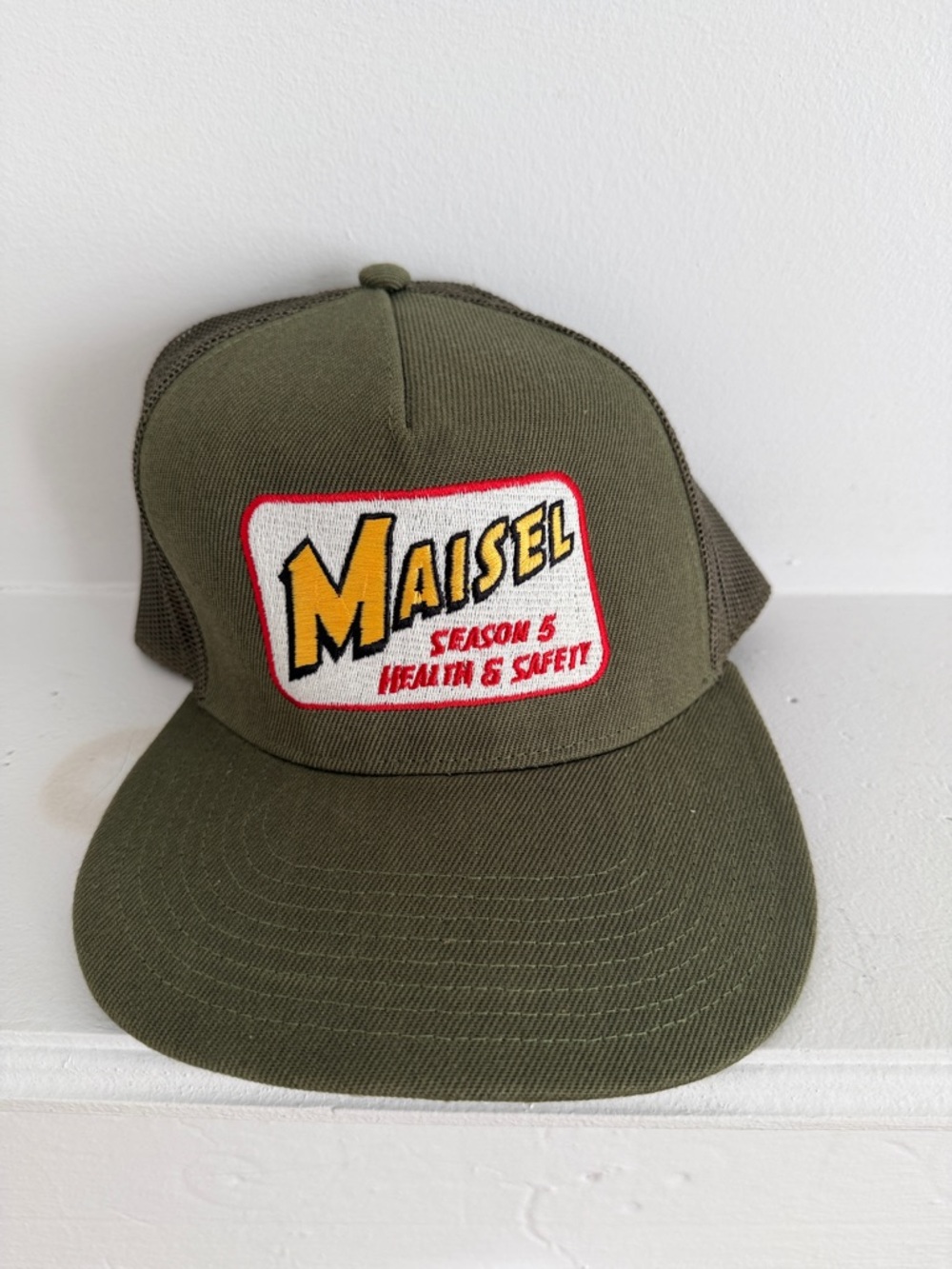 Unisex Maisel Season 5 Health & Safety Olive Mesh Trucker Hat